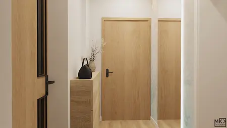 Wnętrze nowoczesnego przedpokoju z drewnianymi drzwiami, szafką i dekoracjami.