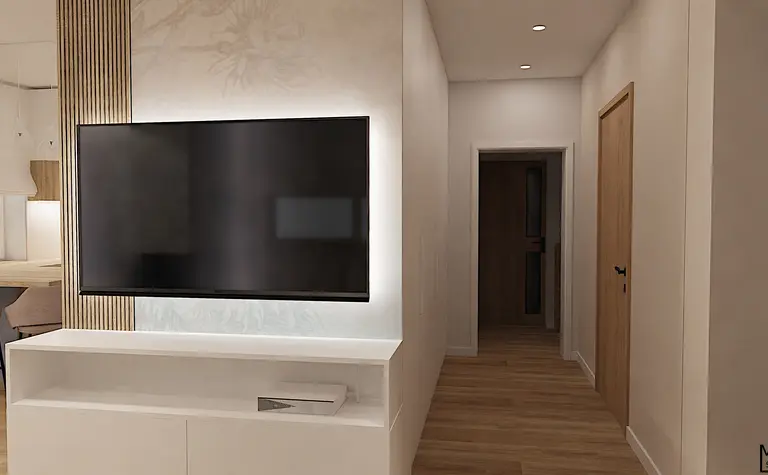 Wnętrze z telewizorem, drewnianą podłogą, jasnymi ścianami i nowoczesnym oświetleniem.
