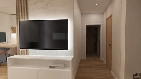 Wnętrze z telewizorem, drewnianą podłogą, jasnymi ścianami i nowoczesnym oświetleniem.