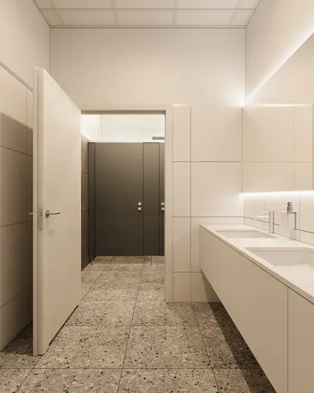 Wnętrze nowoczesnej łazienki z minimalistycznym designem i szarymi płytkami.
