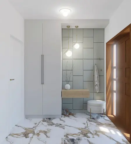 Przedpokój z szarymi płytkami, drewnianymi elementami i minimalistycznym wystrojem w stylu quiet luxury.