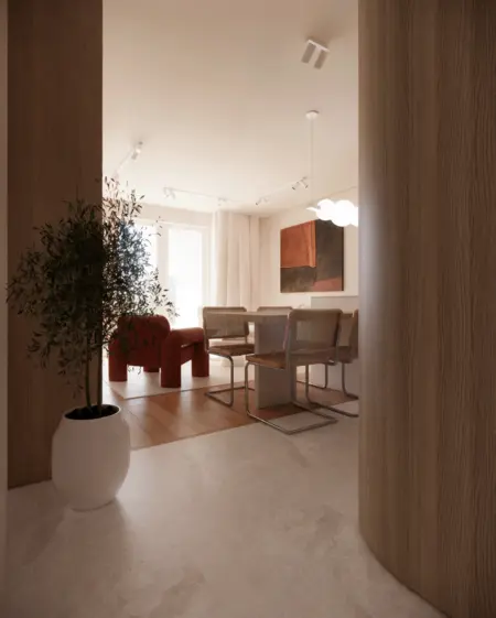 Wnętrze jadalni w stylu minimalistycznym z drewnianym stołem, czerwonym fotelem i rośliną.