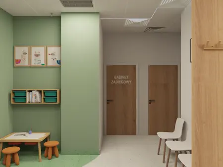 Gabinet z zielonymi ścianami, drewnianymi drzwiami i nowoczesnym wystrojem skandynawskim.