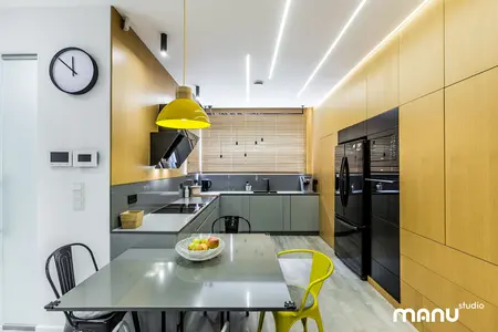 Wnętrze kuchni w stylu industrialnym i minimalistycznym z nowoczesnymi meblami.