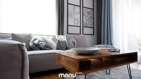 Nowoczesny salon z szarymi poduszkami i drewnianym stołem, styl skandynawski, współczesny.