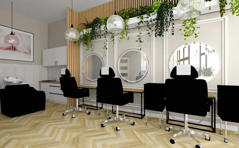 Wnętrze salonu fryzjerskiego z czarnymi fotelami i roślinami.