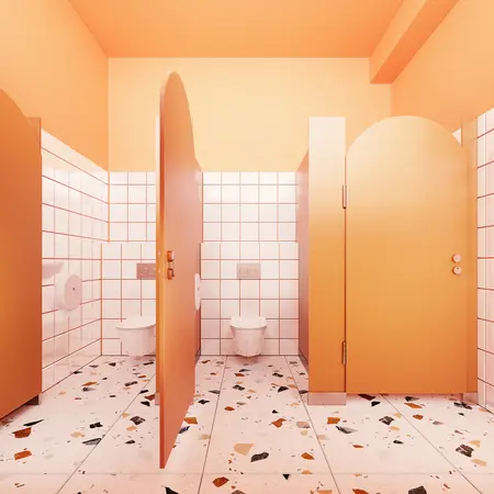 Wnętrze toalety w stylu dopamine decor z pomarańczowymi akcentami i nowoczesnymi płytkami.
