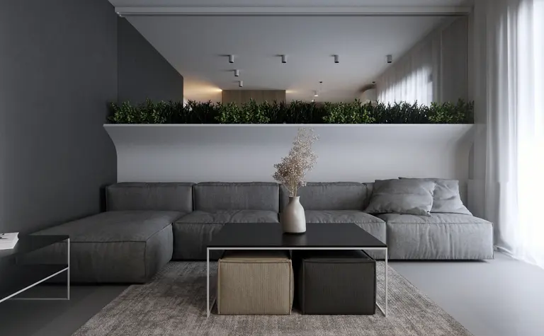 Wnętrze salonu w stylu eklektycznym i minimalistycznym z szarym narożnikiem i roślinami.