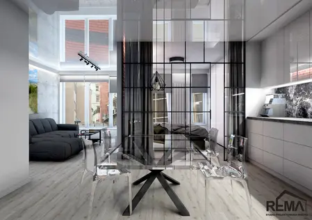 Wnętrze nowoczesne z industrialnymi akcentami, przezroczysty stół i czarna sofa.