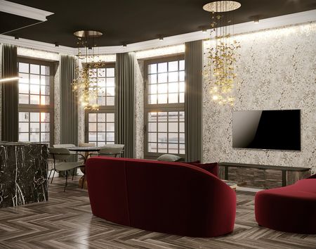 Wnętrze salonu w stylu art deco z czerwonymi sofami i marmurowymi akcentami.