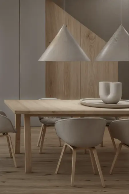Wnętrze jadalni z drewnianym stołem, minimalistycznymi lampami i eklektycznymi akcentami.