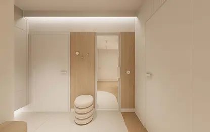 Przedpokój w stylu japandi z minimalistycznym wystrojem, jasnymi ścianami i drewnianymi akcentami.