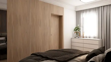 Wnętrze sypialni z drewnianą ścianą, białymi meblami i roślinami.