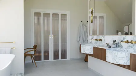 Wnętrze łazienki w stylu art deco z marmurowymi wykończeniami i złotymi detalami.