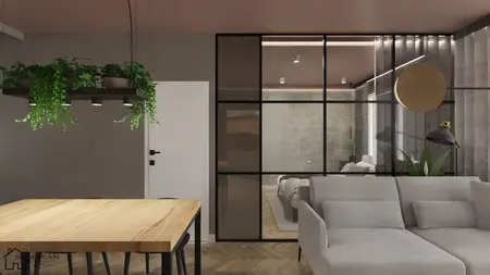 Wnętrze salonu z industrialnym stylem, szare ściany, drewniany stół i rośliny.