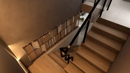Wnętrze schodów z drewnianymi stopniami, szarymi ścianami i nowoczesnym balustradą.