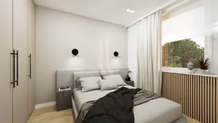 Sypialnia w stylu japandi i minimalistycznym z szarymi ścianami, drewnianymi meblami.