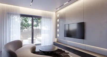 Wnętrze salonu z telewizorem, minimalistycznymi meblami i dużym oknem.