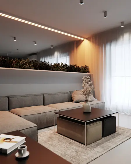 Eklektyczny minimalistyczny salon z szarymi meblami i roślinami.