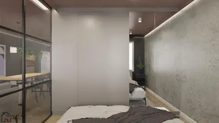 Sypialnia w stylu industrialnym z białymi ścianami i szarymi detalami.