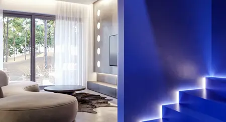 Wnętrze z niebieską ścianą, nowoczesnymi meblami i dużymi oknami w stylu minimalistycznym i industrialnym.