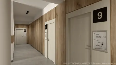 Korytarz z drewnianymi panelami i szarymi drzwiami, nowoczesny design.