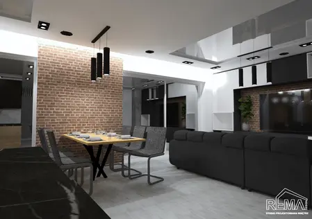 Wnętrze jadalni w stylu industrialnym z drewnianym stołem, czarnymi krzesłami i ceglaną ścianą.