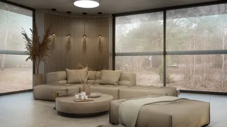 Nowoczesny salon w stylu boho i skandynawskim z beżową sofą i drewnianymi elementami.