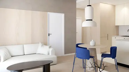 Wnętrze w stylu japandi z jasnym drewnem, minimalistycznymi meblami i niebieskimi akcentami.