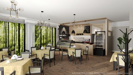 Wnętrze restauracji z drewnianymi stołami, zielonymi dekoracjami i nowoczesnym oświetleniem.