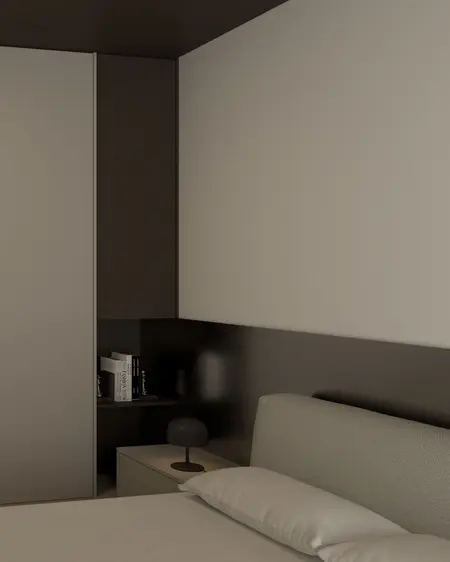 Sypialnia w minimalistycznym stylu z szarymi ścianami i nowoczesnym oświetleniem.