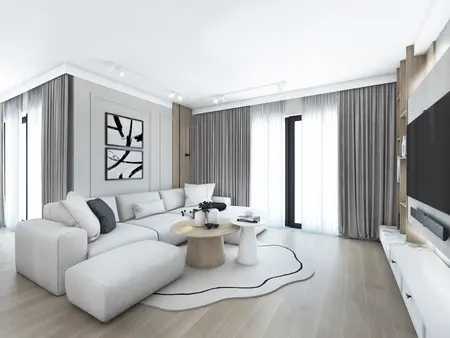 Wnętrze salonu w stylu japandi, minimalistycznym i nowoczesnym z białą sofą.