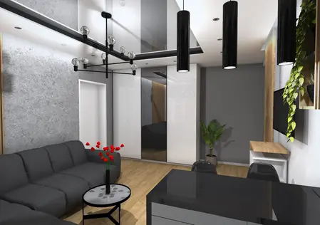 Wnętrze salonu w stylu industrialnym z czarną sofą, szarymi ścianami i rośliną.