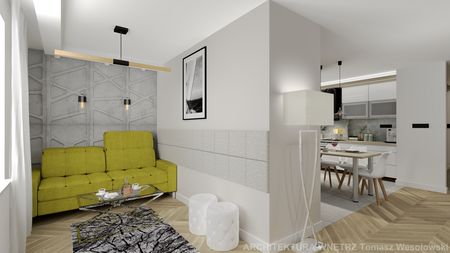 Wnętrze nowoczesnego salonu z zieloną kanapą i betonową ścianą