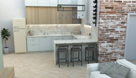 Kuchnia w stylu industrialnym i nowoczesnym z beżowymi meblami, marmurowym blatem oraz ceglaną ścianą.