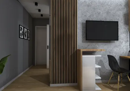 Wnętrze biura w stylu industrialnym z drewnianymi elementami i szarymi ścianami.