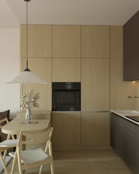 Minimalistyczna kuchnia z drewnianymi meblami i nowoczesnymi urządzeniami.