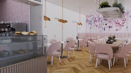 Wnętrze kawiarni z różowymi meblami i roślinami w stylu dopamine decor.