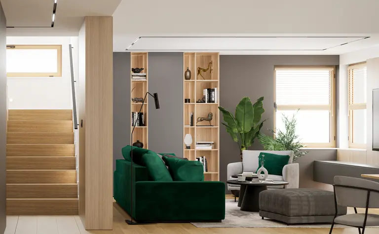 Wnętrze salonu z zieloną sofą, drewnianymi meblami, minimalistycznym designem.