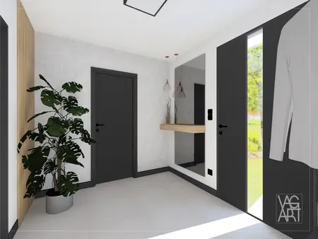 Przedpokój w stylu industrialnym z rośliną i lustrem.