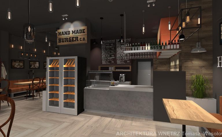 Wnętrze kawiarni z industrialnym stylem, drewniane meble i szare akcenty.