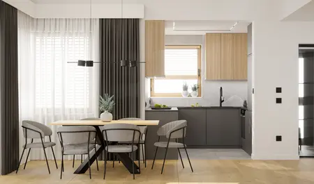 Wnętrze kuchni z drewnianymi meblami i szarym blatem, minimalistyczny design.