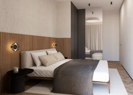 Wnętrze sypialni z nowoczesnym łóżkiem, drewnianą ścianą oraz stylowymi lampami.
