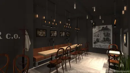 Wnętrze jadalni w stylu industrialnym z drewnianym stołem i lampami.