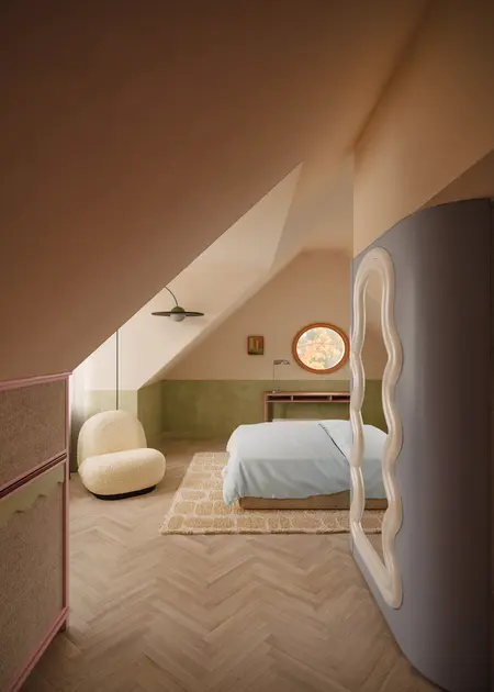 Wnętrze poddasza z minimalistycznym designem, zieloną ścianą, vintage meblami i oświetleniem.