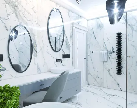 Nowoczesna łazienka z marmurowymi ścianami, lustrami i dodatkami w stylu glamour i współczesnym.