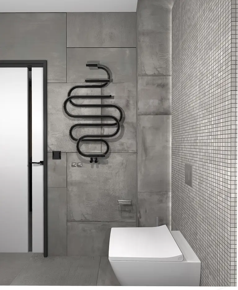Nowoczesna łazienka z szarymi ścianami i minimalistycznymi detalami, industrialny styl.