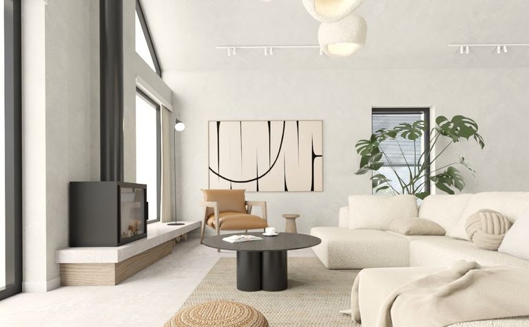 Wnętrze salonu w stylu japandi, minimalistycznym z beżową sofą i roślinami.