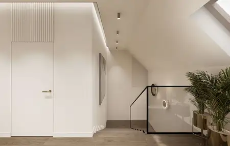 Wnętrze korytarza z minimalistycznym designem, jasne ściany, drewniana podłoga.