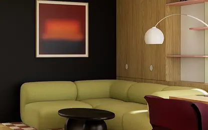 Wnętrze salonu w stylu art deco z zieloną sofą, czarnym stolikiem i drewnianymi akcentami.